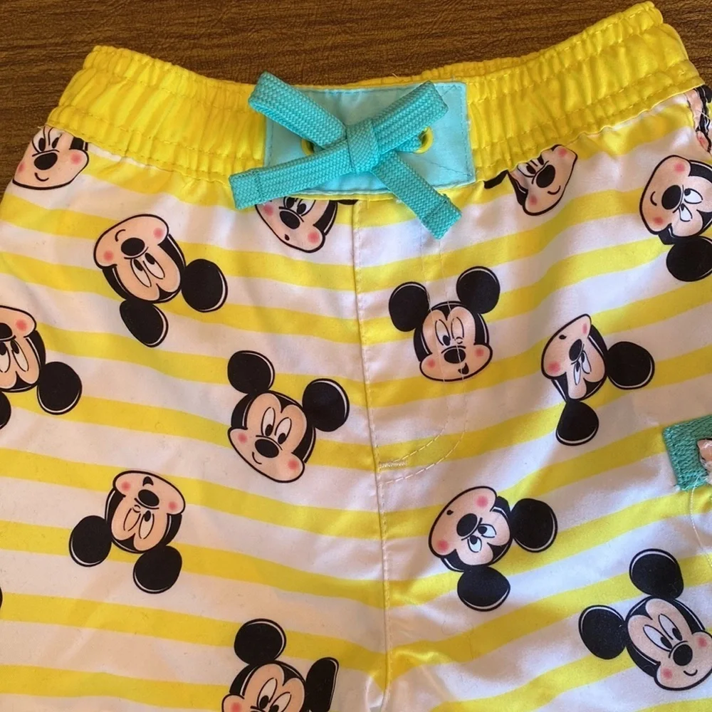 NWT Disney swim trunks size 9-12M